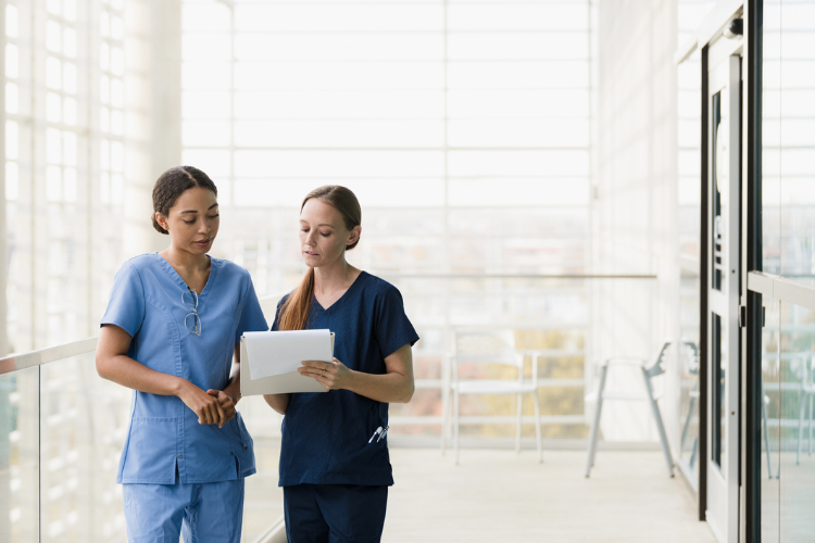 two nurses talking in hospital