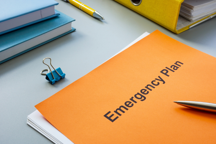 folder with emergency plan written on it