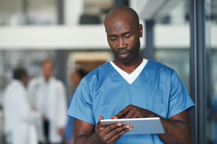 healthcare worker on a tablet