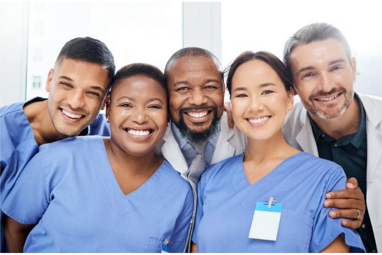 Group of smiling healthcare workers that model improving healthcare employee attitudes
