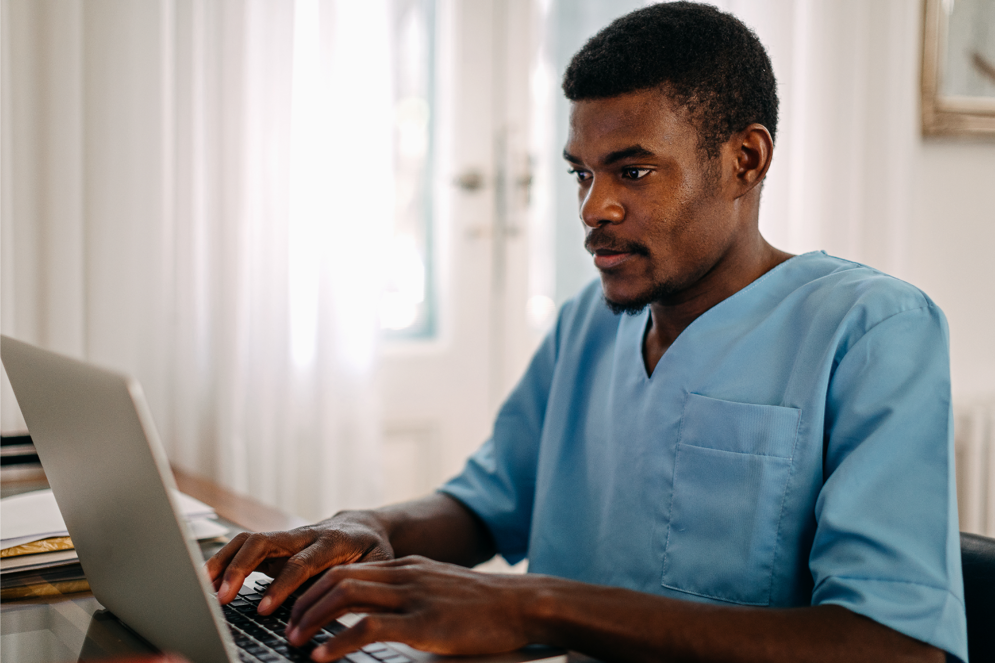 Male nurse completing CPR and First Aid training and testing online