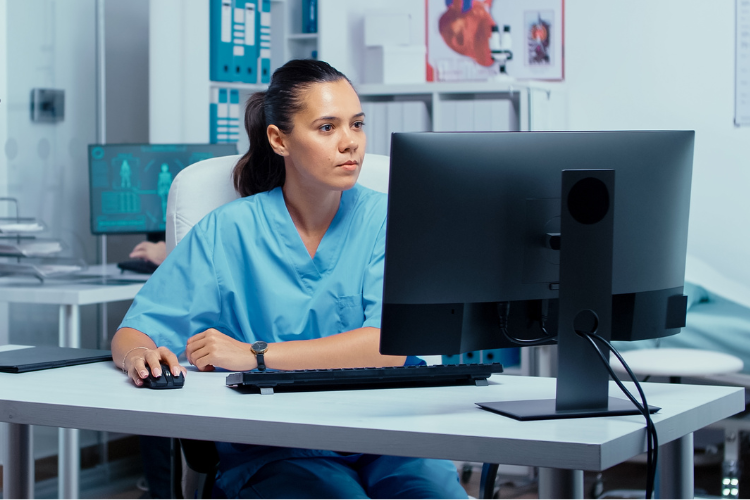 Nurse at a computer in a hospital