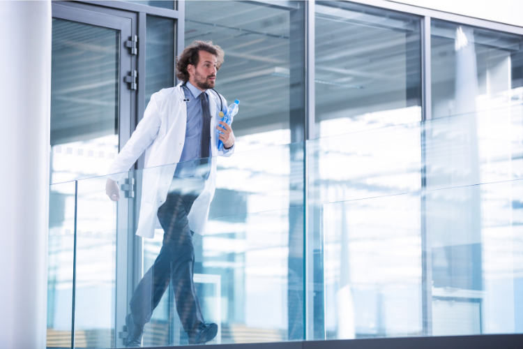 Doctor walking fast in hospital