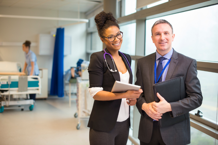 two executives standing in hospital